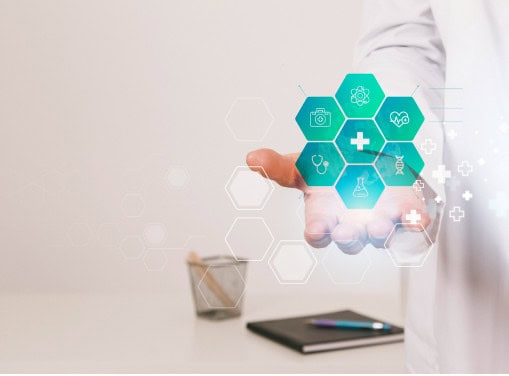 Doctor holding a digital icon display representing healthcare services and innovation, highlighting advanced healthcare solutions.