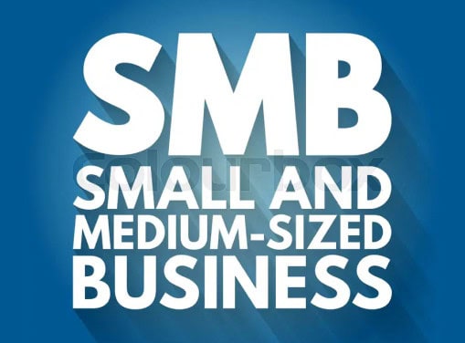 Hand holding a glowing lightbulb with digital icons, symbolizing innovative business solutions for small and medium-sized businesses.